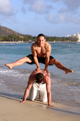 Two teenage boys having fun on the beach