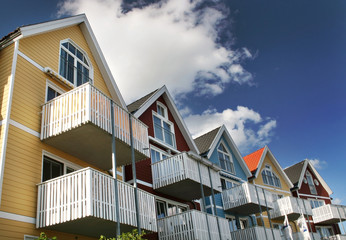 Wall Mural - Five colorful house with blue sky