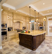 © Daniel Ouellette - Beige kitchen with a large island