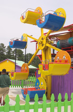 A Kiddie Ferris Wheel At An Amusement Park.