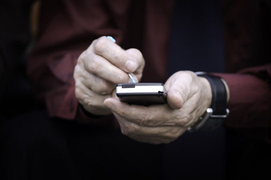 businessman works with palmtop