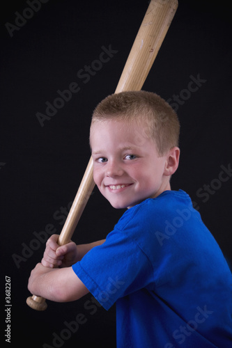 Cute little eight year old boy holding a baseball bat. Stock Photo | Adobe  Stock