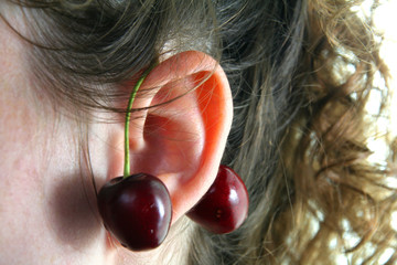 close-up of two ripe cherry as a earring