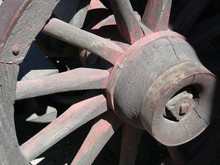 Weathered Spokes On The Wheel Of An Old Covered Wagon
