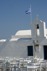 restaurant taverna by classic greek island church   greece