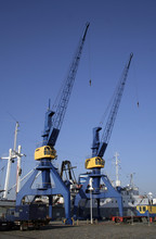 Blue And Yelllow Crane On Dock
