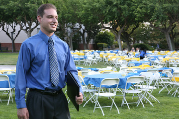 A business man attending a banquet outside