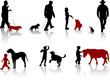 Silhouette of people with dogs and pony