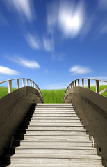 Wall Mural - Wooden bridge ending in a beautiful green meadow 