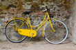 Old yellow bike on the wall