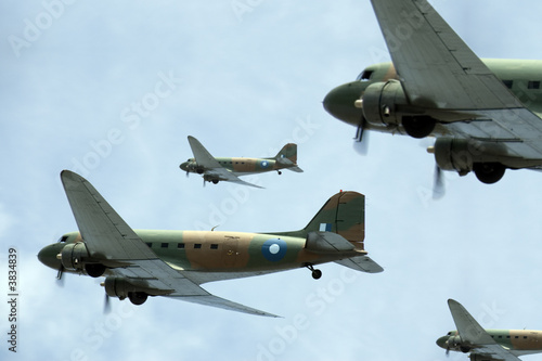 Cuadros en Lienzo A flight of transport planes banking to starboard.