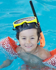 Poster - photo of an adorable boy learning to swim