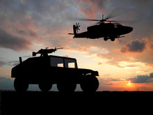 Silhouette Of Truck Over Sunset With Helicopter.