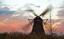 Windmills In Kinderdijk (Netherlands) At Windy Sunset. 