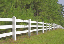 A Decorative White Split Rail Fence.