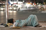 Fototapeta Sypialnia - male homeless sleeping in a street