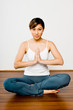 © EastWest Imaging - Woman Doing Yoga