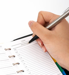 Poster - writing on an organizer