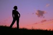 © Pavel Losevsky - woman silhouette against sunset