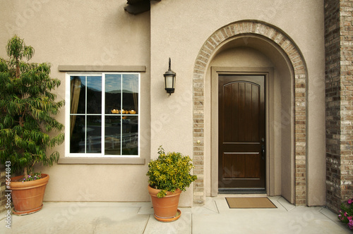 Fotografie, Obraz A newly constructed, modern american home doorway and patio.