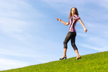 Happy woman on a hill