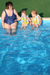 © Pavel Losevsky - grandma and grandchildren on the side of the pool