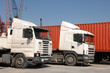 © JoLin - Trucks and containers in port