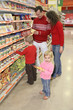 © Pavel Losevsky - parents with son and daughter in shop