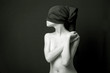 Nude woman with black bandage