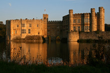 The Sun Doing Down On Leeds Castle With Moon In The Sky