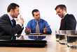 © endostock - Three businessmen handling negotiations.