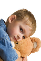 Wall Mural - Sad kid embraces a teddy