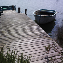 Wooden Dock And Rowboats