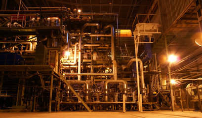 Equipment, cables and piping as found inside of a modern industr