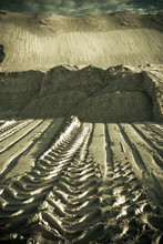 Prints Of Wheels On Sand
