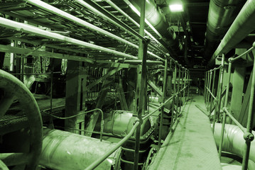 equipment, cables and piping as found inside of a modern industr