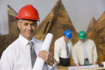 Wall Mural - Engineers studying plans