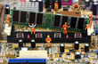 Miniature workers installing RAM memory