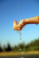 Wall Mural - fresh water falling on children hands