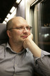 © Offscreen - The man thoughtfully looks out of the window trains