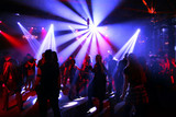 Dancing people in an underground club
