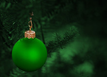 Christmas Tree Ornamented With A Green Bauble