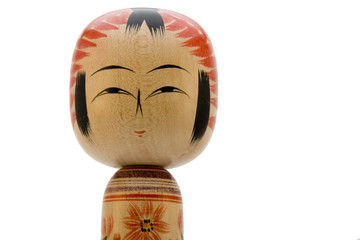 Japanese Kokeshi doll close-up on white background