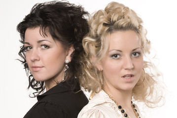 Portrait of two beautiful women on a white background