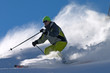extreme freeride skier moving down on ski slope