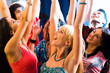 © pressmaster - Happy young people lift up the hands at a party