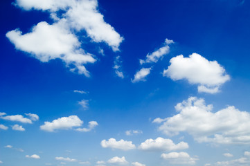 Wall Mural - white fluffy clouds in the blue sky.