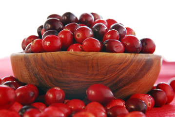 Wall Mural - Fresh red cranberries in a wooden bowl