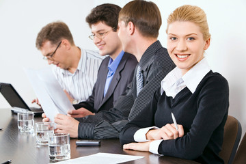 Canvas Print - Confident people sitting at the table at business meeting