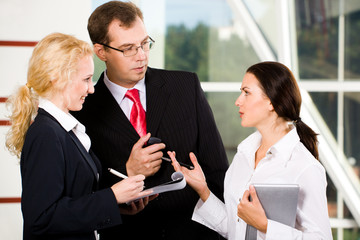 Wall Mural - Portrait of three business communicate each other at meeting